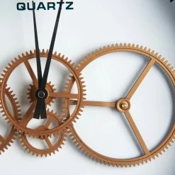 Horloge engrenages or fond blanc