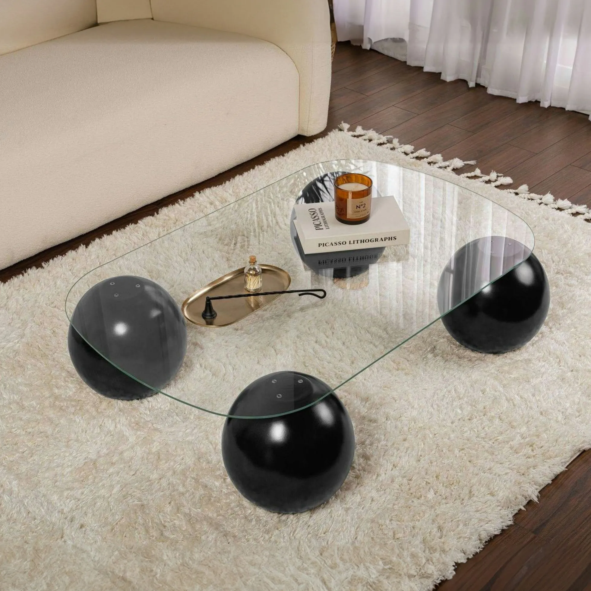 Table basse verre bords arrondis - 4 pieds boules noirs KOCHI