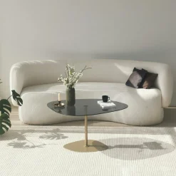 Table basse verre fumé minimaliste, galet et pied doré TULUM
