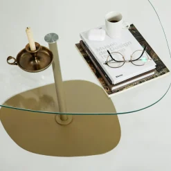 Table basse verre minimaliste forme galet et pied doré TULUM