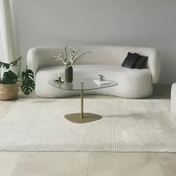 Table basse verre minimaliste forme galet et pied doré TULUM