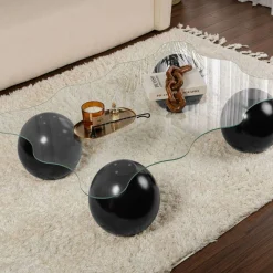 Table basse verre profil ondulé - 4 pieds boules noirs KOCHI